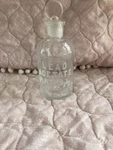 Vintage Wheaton Glass Bottle With Topper Raisede Embossed Lettering 150 Ml. Fixed Price $18.00.