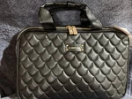Joan & David 13X8 Black Padded Travel Hanging Toiletry Case + 2 Bottles. Fixed Price $34.99.