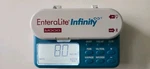 Zevex Moog Enteralite Infinity Feeding Pump And Power Cord. Fixed Price $210.00.