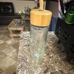 Clear Glass Water Bottle Floral Design Bamboo Lid Screw Top Loop Hand Wash Only. Fixed Price $15.00.